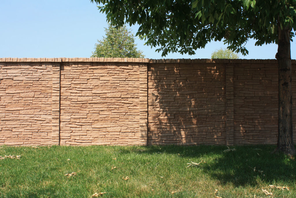 Concrete privacy fence example on grass